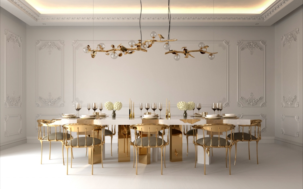 50 luxury dining rooms - luxury dining room with a dining table with gold metal details, chairs with a gold metal frame and a seat with a grey fabric and a gold ceiling lamp