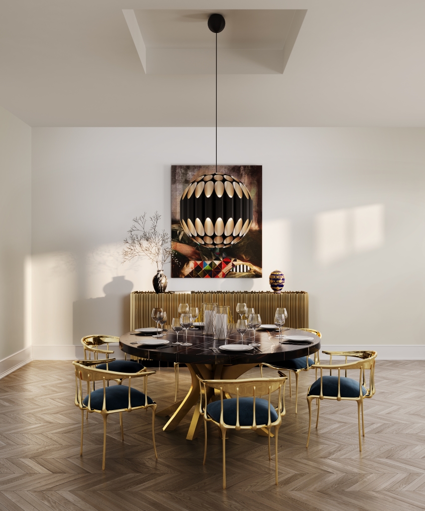 50 luxury dining rooms - luxurious dining room, with a round wooden dining table with golden details, chairs with a golden metal frame and a dark blue fabric seat, a round lamp and a golden sideboard in the background and a painting on the wall