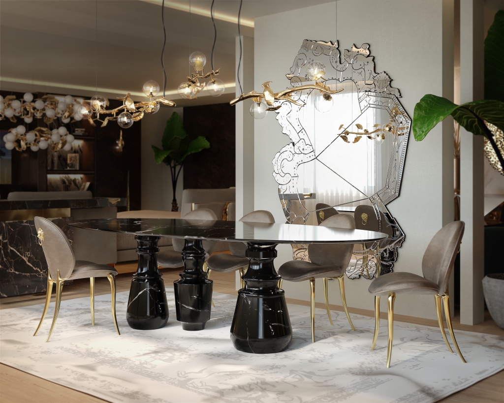 50 luxury dining rooms - luxury dining room, with a black marble dining table, chairs with grey velvet fabric and gold legs and a large wall mirror with a unique irregular detail on the glass
