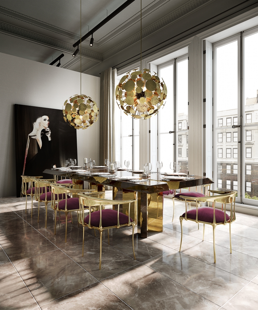50 luxury dining rooms - luxury dining room, with a wooden dining table with gold details, chairs with a gold metal frame, the seat in bordeaux-coloured fabric and two round lamps also in gold