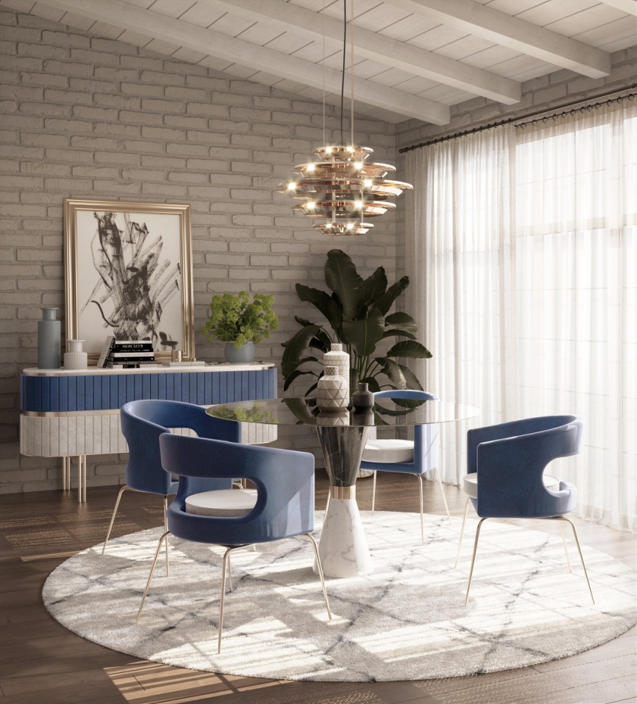 50 luxury dining rooms - luxury dining room, with a round marble dining table with a black top and white base and gold detailing in the middle, blue chairs with gold legs, a gold suspension lamp above the table and a blue and white sideboard with gold detailing behind
