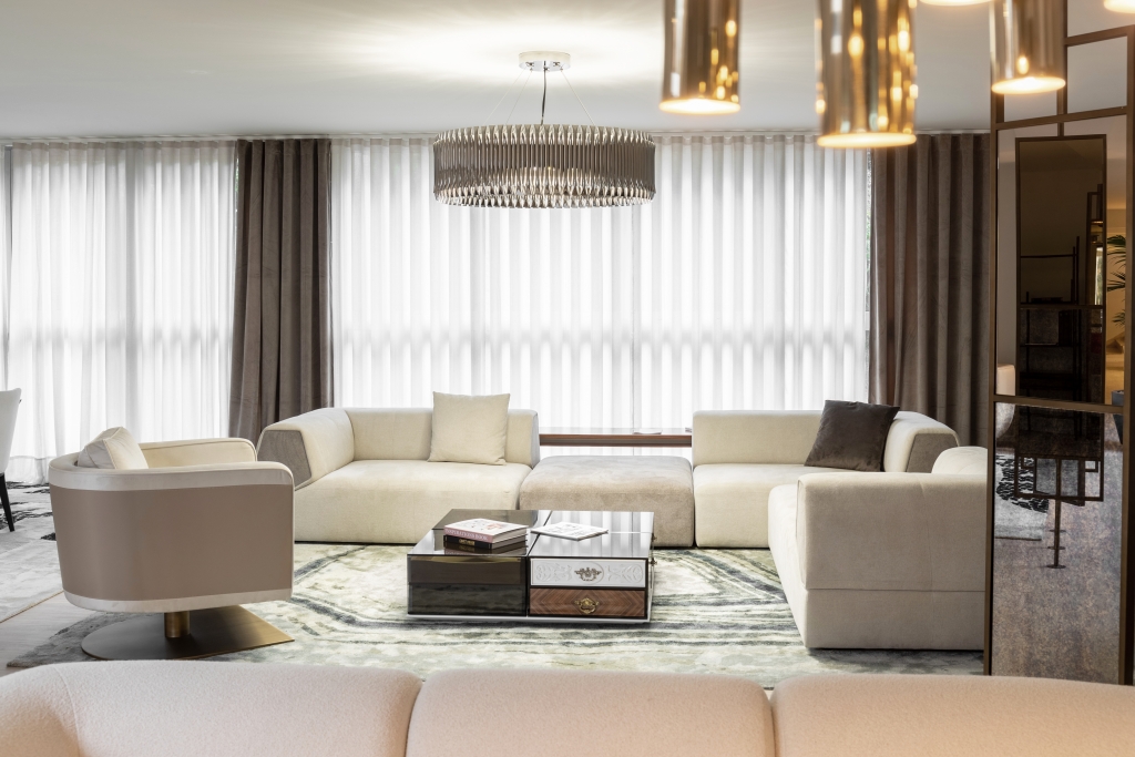 50 luxury center tables - living room with nude sofa and bege armchair, round suspension lamp and center table with different materials