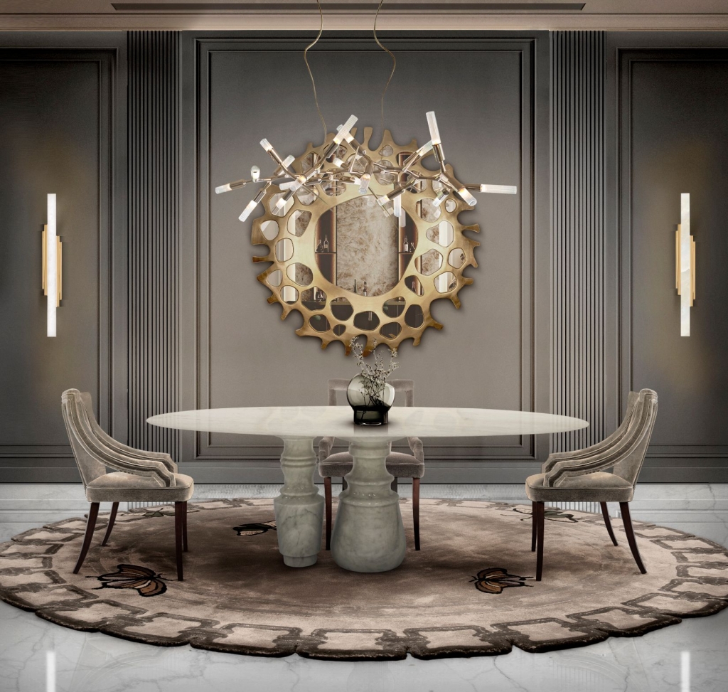 50 luxury dining tables - luxury white marble dining table with two grey velvet chairs and brown legs, above a suspension lamp,  behind a gold wall mirror with a unique shape