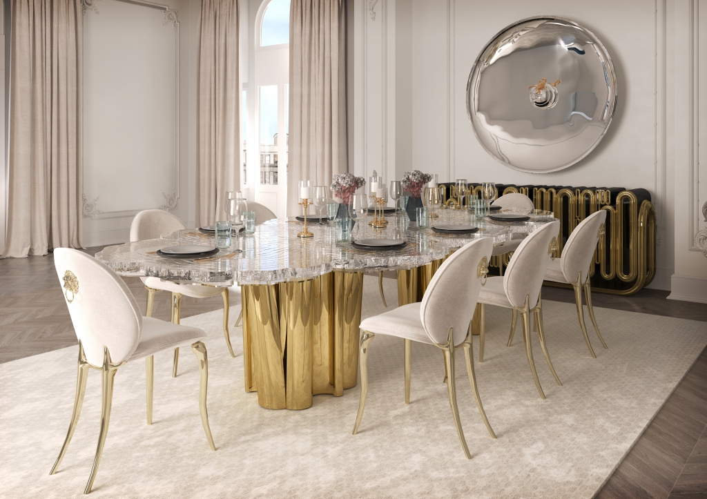 50 luxury dining tables - luxurious dining room with a golden table reminiscent of a tree, chairs with beige fabric, golden legs and a small golden lion detail on the back, a golden sideboard with round details and a wall mirror at the back of the room