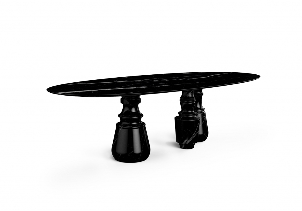 Luxury Dining Room Sets - a black marble dining table with three legs and a round top. The marble has a few tears in white that is naturaly from the stone.