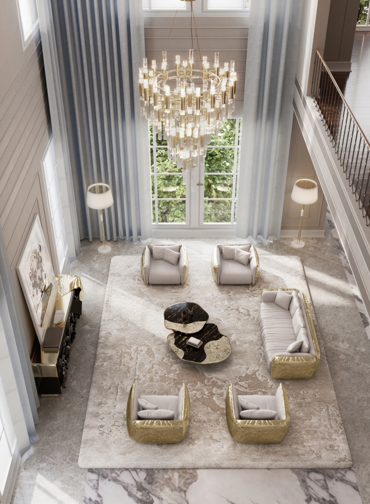 Luxury- Alt Text:
A luxurious, high-ceilinged living room with a grand crystal chandelier as the centerpiece. The room features a symmetrical arrangement of plush white sofas and armchairs with gold accents, a large patterned rug, and a unique black and gold coffee table. Floor-to-ceiling windows and elegant curtains fill the space with natural light.