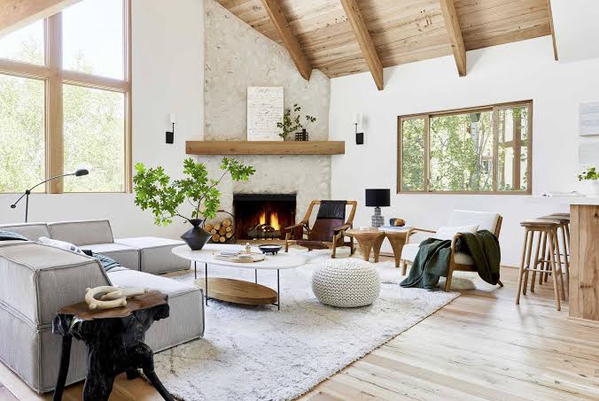 Spacious modern living room with fireplace and high ceiling, interior designers