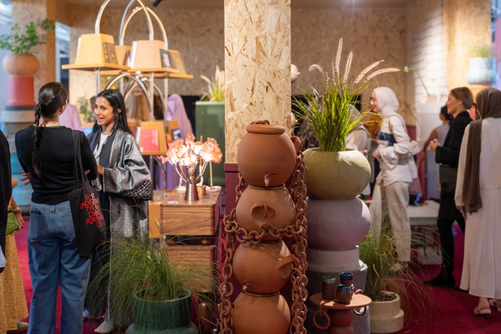 Exhibition stand featuring handcrafted furniture and decorative pieces, highlighting the artisanal craftsmanship and exclusive designs showcased at Downtown Design Dubai 2025.