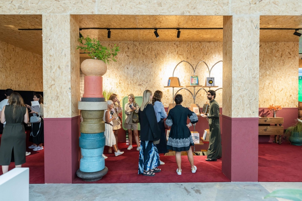 Exhibition stand displaying handcrafted luxury pieces, providing a close-up view of Boca do Lobo’s or other designers’ artisanal furniture and decorative creations.