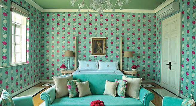 Turquoise bedroom with floral wallpaper, luxury interior designers in India