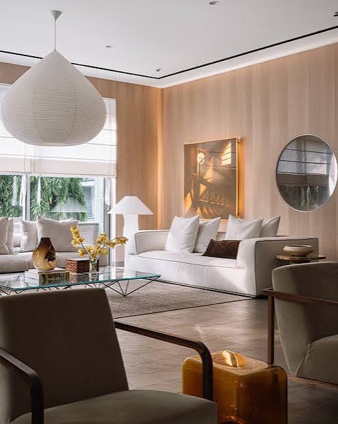 Modern lounge with white sofa and lamp, luxury interior designers in India