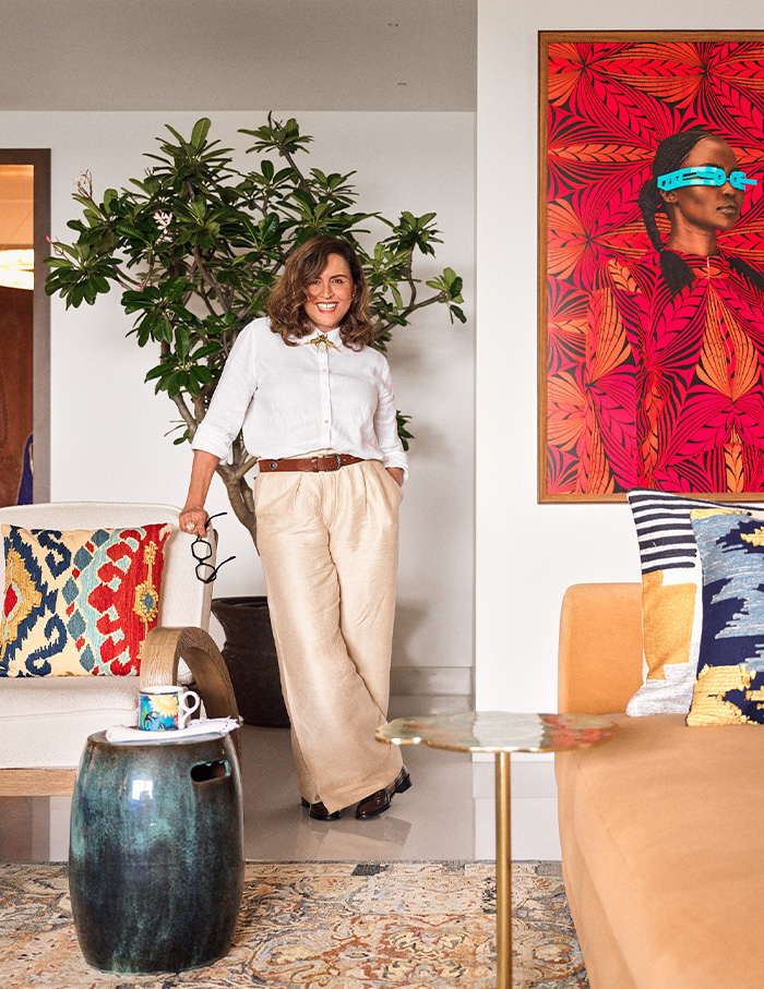Designer standing in a chic living room, luxury interior designers in India