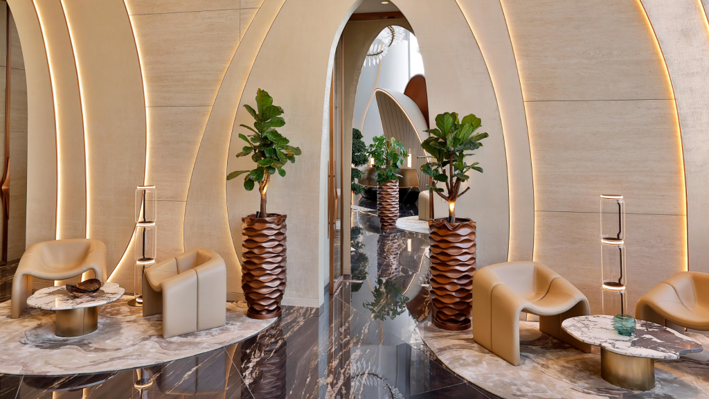 Ciel Dubai Marina lobby with high ceilings, marble and metallic finishes.