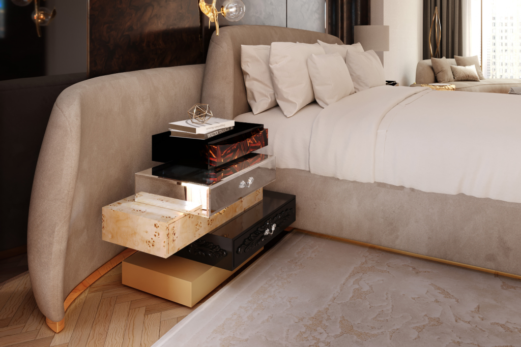 Contemporary bedroom scene with an upholstered bed in neutral tones and a stacked multi-drawer nightstand featuring mixed materials and finishes.