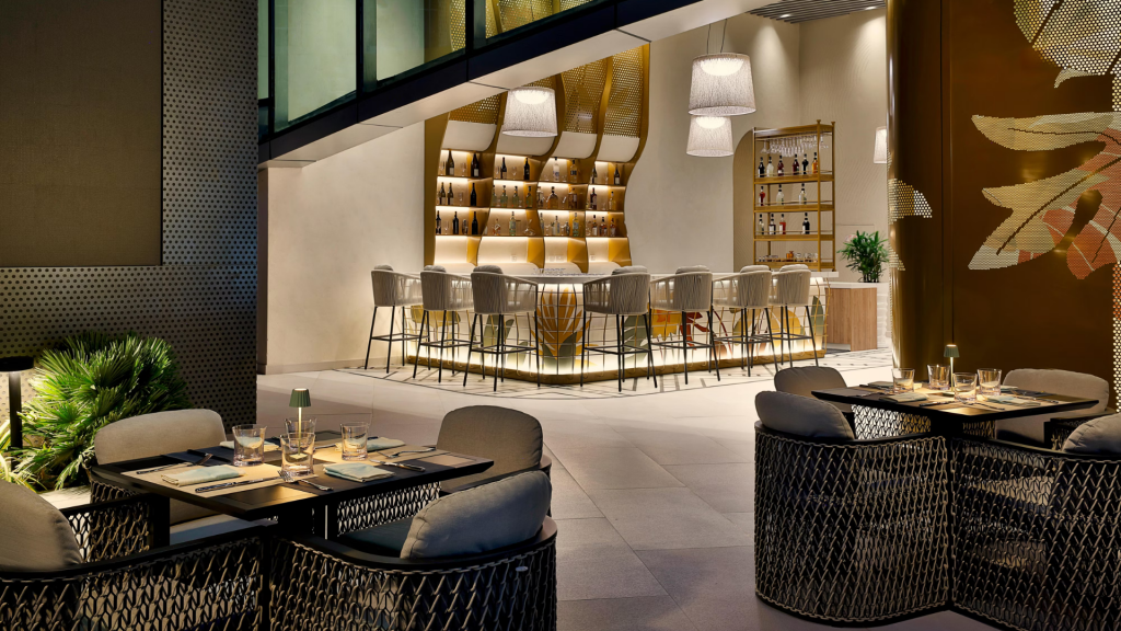 Elegant dining area at Ciel Dubai Marina featuring panoramic views, luxurious furnishings and contemporary design.