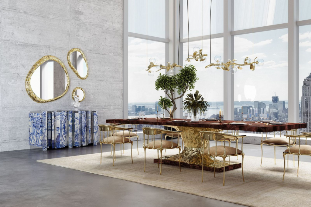Sculptural Design Metamorphosis Dining Table by Boca do Lobo in an exclusive dining hall featuring a walnut root veneer and glass top with gold insects.