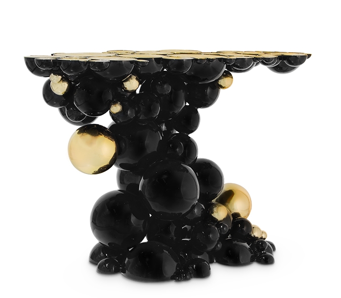 Sculptural Design close up of the Newton Console by Boca do Lobo showing the reflective high gloss finish and the avant-garde technical mastery of the aluminum spheres.