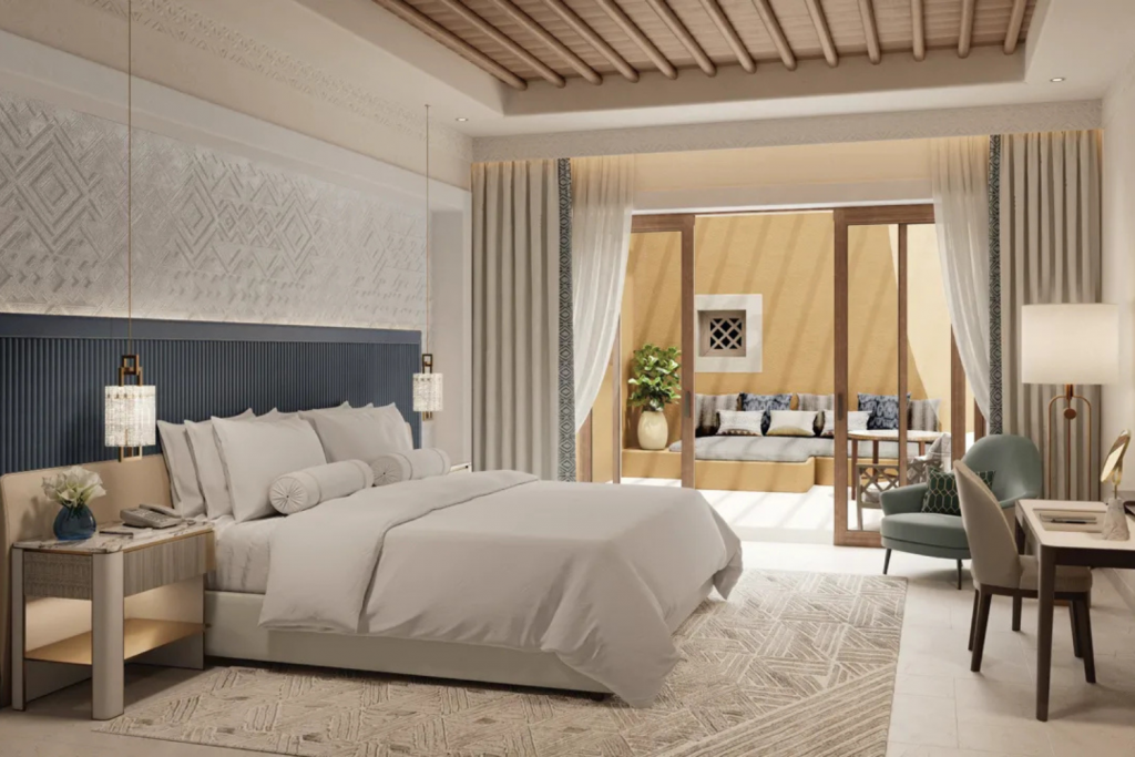 Luxury Hotels Opening in 2026, Contemporary hotel suite with a textured accent wall, private terrace access, and mid-century modern furniture.