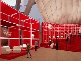 Red architectural exhibition installation at Collectible Design Salone 2026 featuring illuminated modular structures and visitors at Salone del Mobile.Milano in Milan.