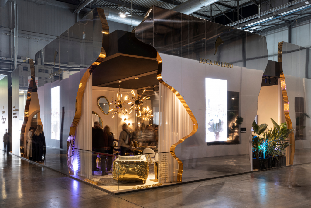 Boca do Lobo stand at Salone del Mobile during Milan Design Week presenting luxury furniture, gold finishes and sculptural lighting within a contemporary exhibition space. Milan Design Week 2026