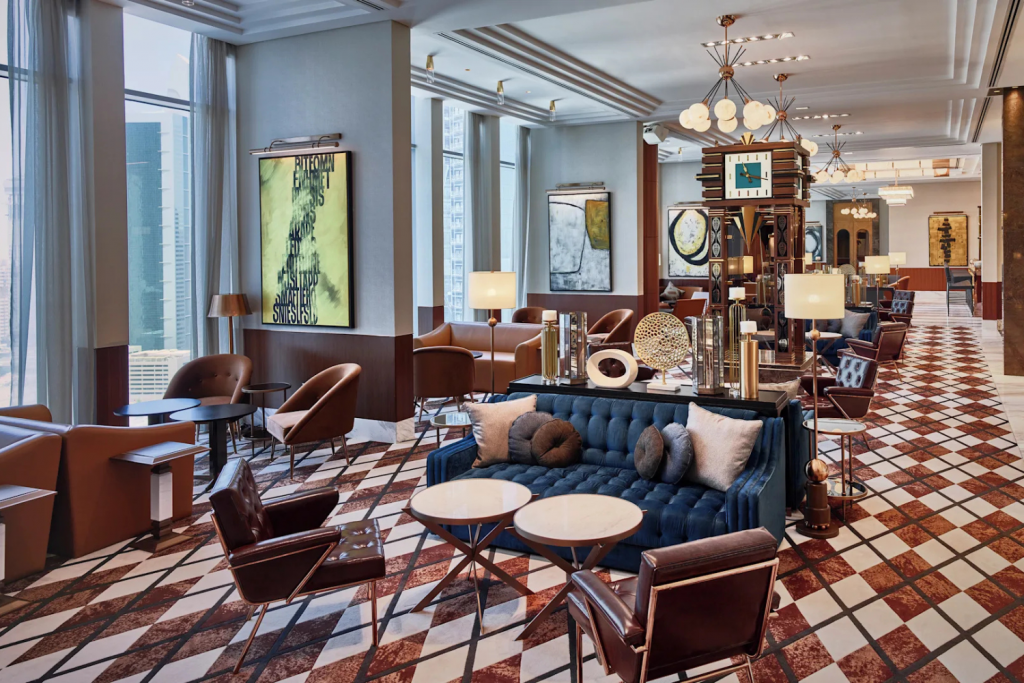 Bull and Bear DIFC, Luxury restaurant interior with blue chairs and gold lights