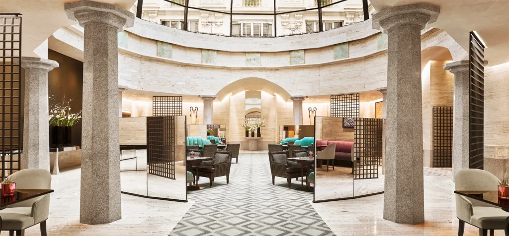 Milan Hotels, beige walls, grey chairs, grey rug