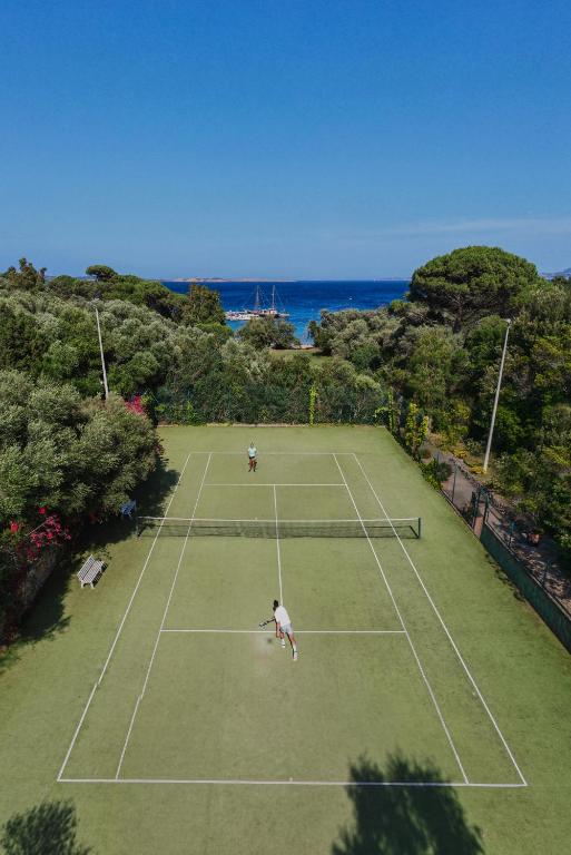 people playing tennis with sea views
