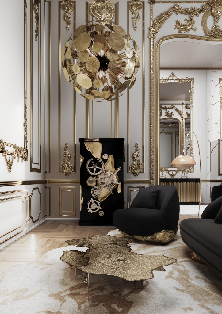 Maximalist Versailles-inspired living room with gilded Rococo wall panelling, massive gold disc chandelier, black lacquer Millionaire safe with clockwork gold detailing, black armchair, gold liquid coffee table, and ornate trumeau mirror living rooms