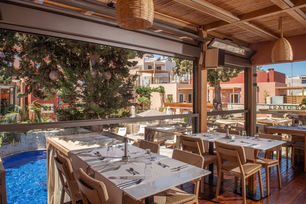 Dining area at Esperides Resort near a pool