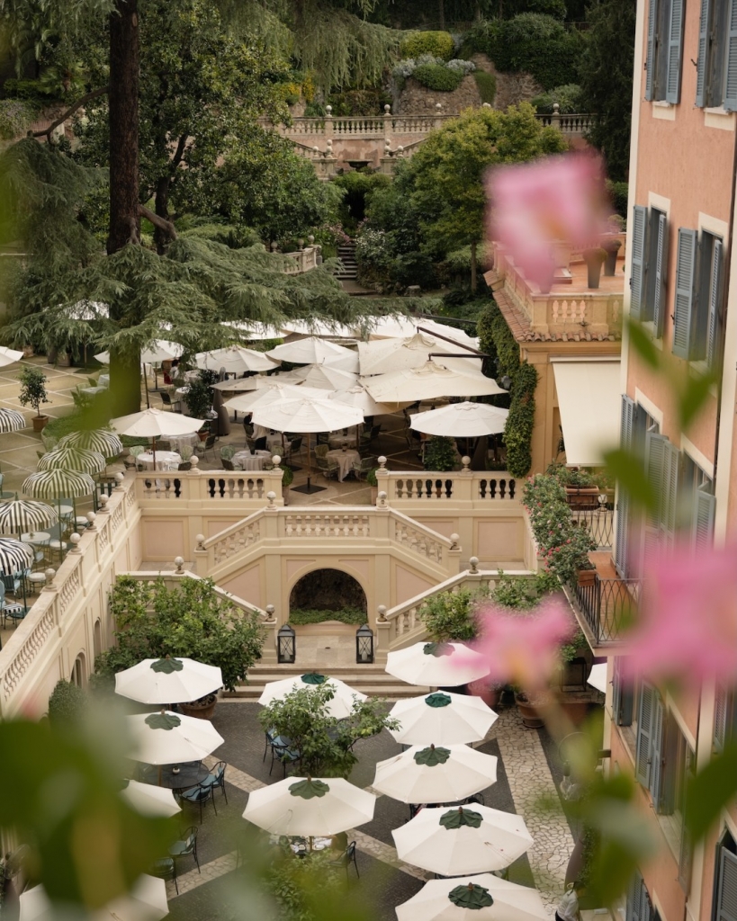 old money style, Historic interior of a luxury hotel in Rome featuring elegant architecture and classic design details.