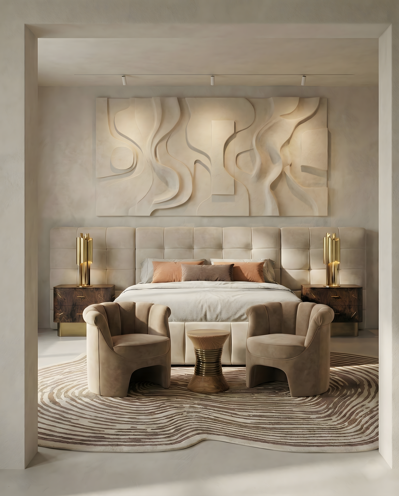 cream walls, brown arm chairs, beige bed, brown and gold nightstand, cream and brown rug