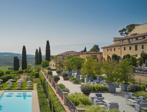 old money style, COMO Castello del Nero is a luxury hotel set within a restored 12th-century castle in the heart of Tuscany. Surrounded by rolling vineyards, olive groves, and picturesque countryside, the property blends historic architecture with contemporary elegance and renowned wellness experiences.