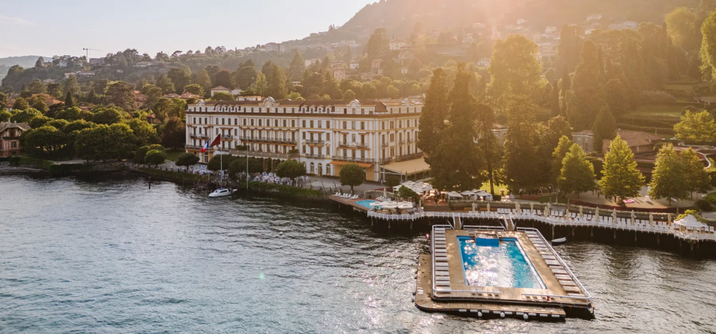 old money style, Elegant hotel located on the shore of a lake, offering peaceful waterfront views and natural surroundings.