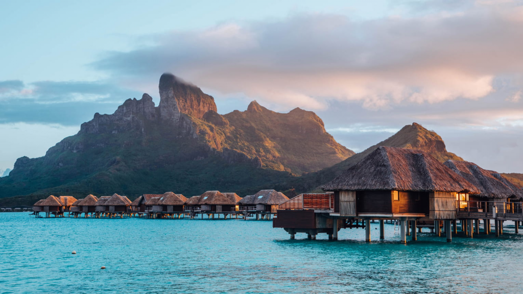 Four Seasons Hotels Resort Bora Bora exterior view featuring luxury overwater villas, turquoise lagoon, and tropical island scenery in Bora Bora, French Polynesia.