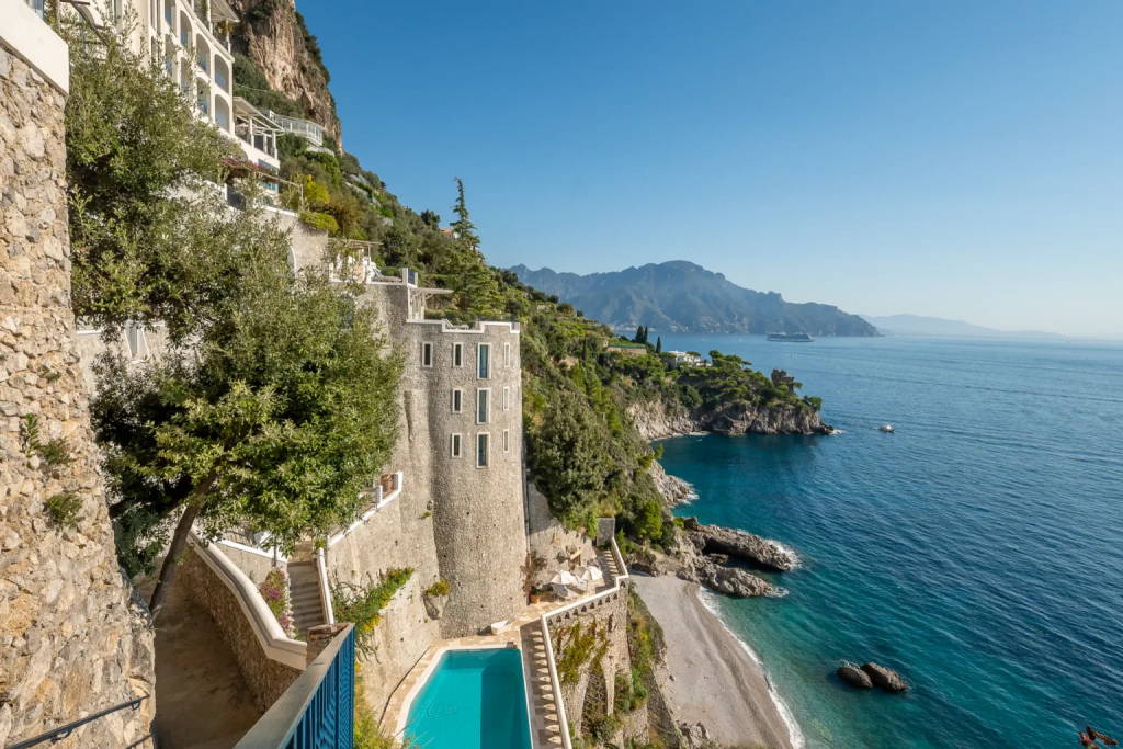 old money style, Borgo Santandrea, a luxury cliffside hotel on the Amalfi Coast with panoramic Mediterranean views, private beach access, and elegant Italian design.