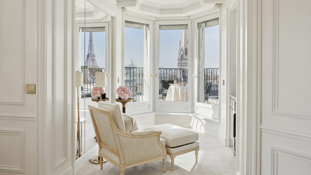 Four Seasons Hotels George V Paris luxury room interior with elegant décor, panoramic Eiffel Tower view, and premium accommodation in Paris, France.