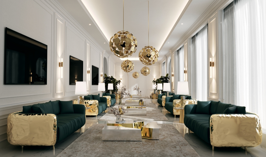 Grand palatial gallery living room with multiple deep emerald velvet sofas featuring sculpted gold bases, cluster of oversized spherical gold disc chandeliers, gold cylindrical wall sconces, and marble floor stretching into infinity living rooms