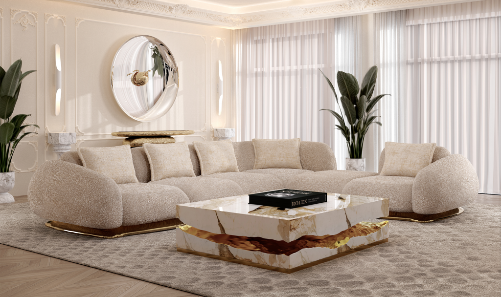 Sophisticated bright interior presenting a curved bouclé sectional with gold trim and a matching marble coffee table, Modular Sofas.