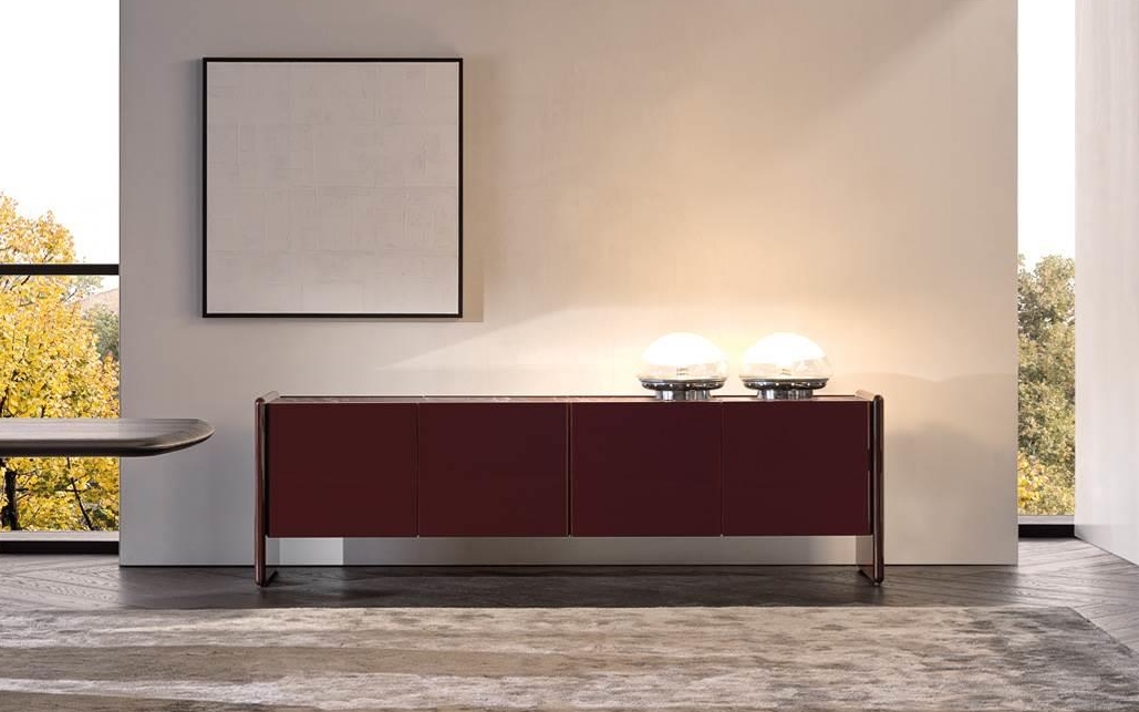Luxury Wood Furniture, A minimalist, sleek burgundy-toned wooden sideboard styled with contemporary table lamps in a spacious room.