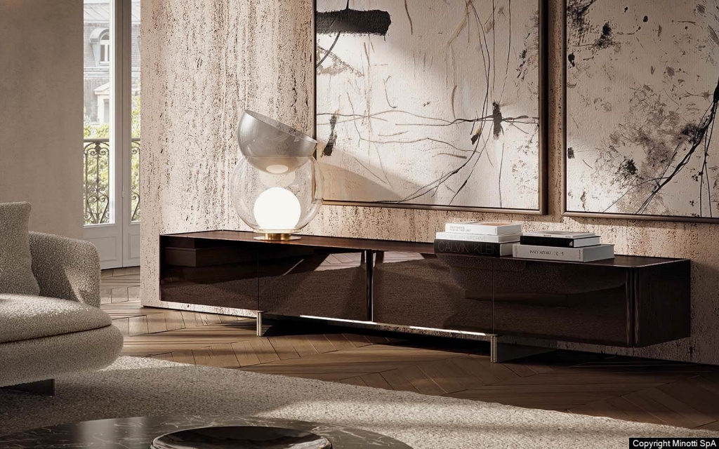 A low-profile dark wood credenza with a reflective finish, positioned beneath abstract art pieces. Luxury Wood Furniture