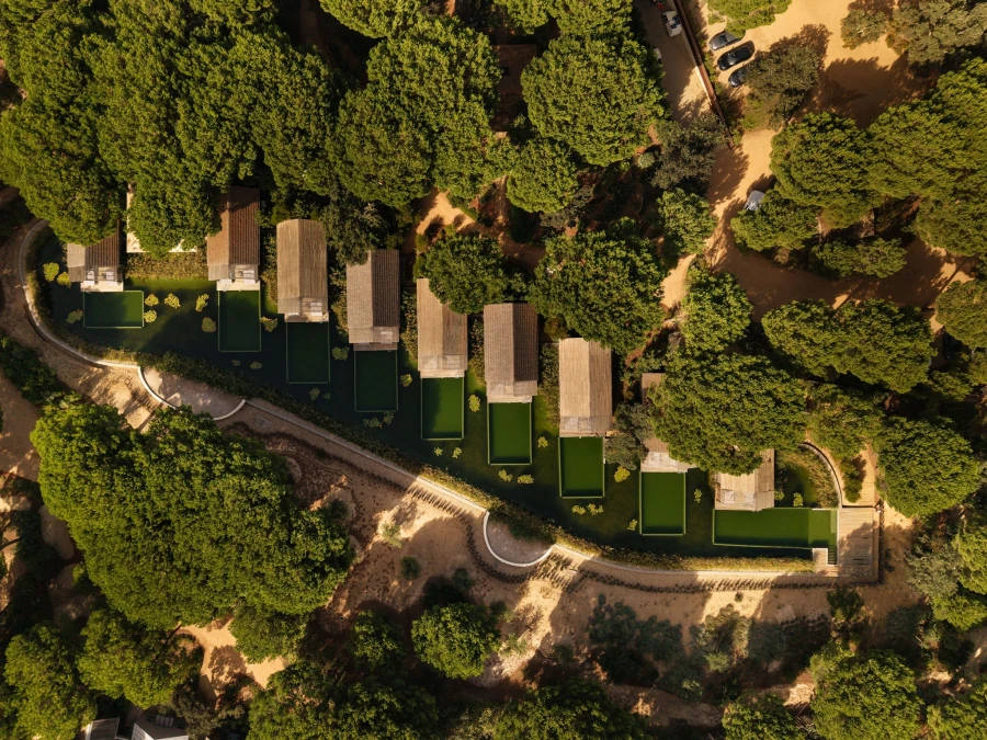 Portugal’s Bucket List Hotels — Sublime Comporta, a luxury eco-retreat surrounded by pine forests and dunes, featuring minimalist white architecture blending into the natural landscape.