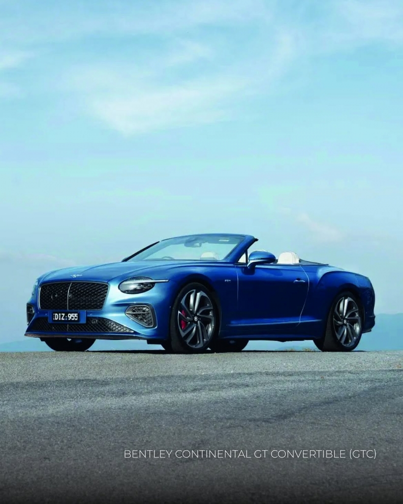 Bentley Continental GT Convertible on scenic road, handcrafted luxury interior