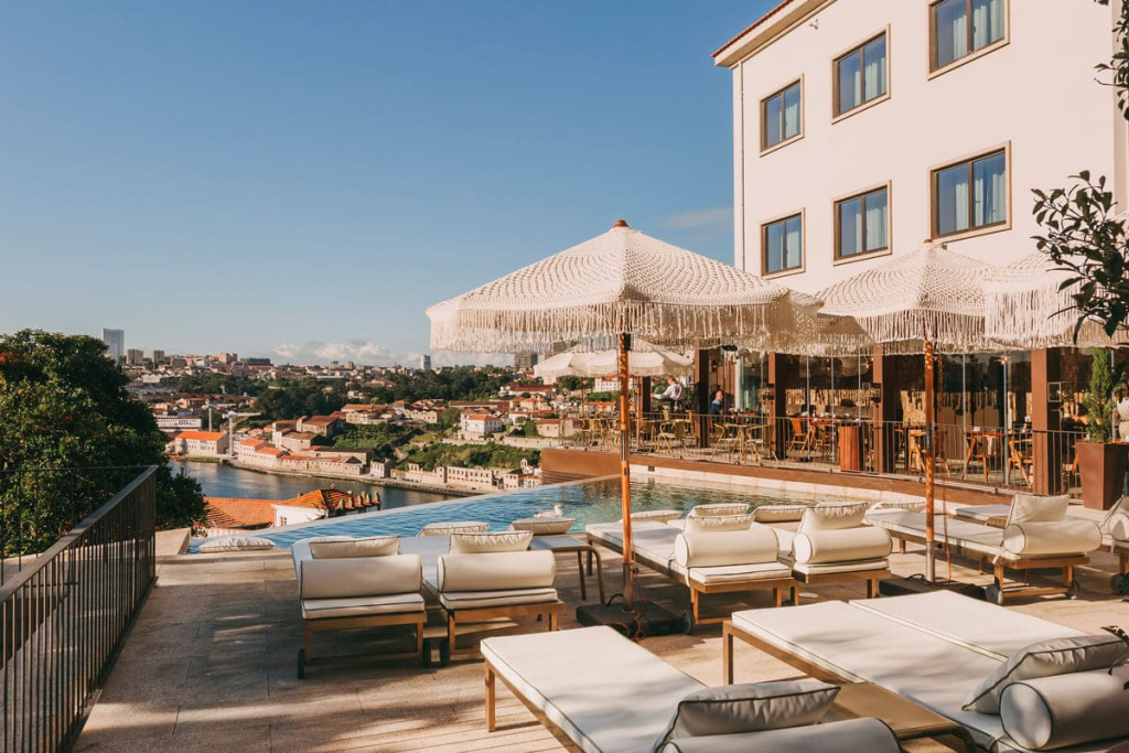Portugal’s Bucket List Hotels — Torel Avantgarde, an art-inspired boutique hotel in Porto with bold contemporary design, curated artworks throughout the interiors, and sweeping views over the Douro River.
