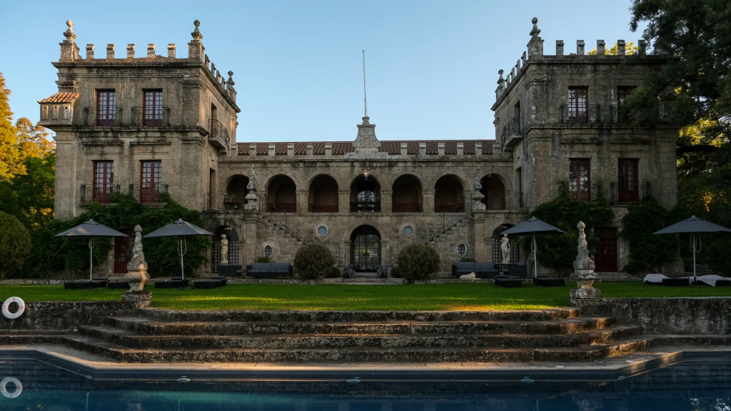 Portugal’s Bucket List Hotels — Paço de Calheiros (Paço do Glória / Lima Valley estate), an elegant historic manor in the Lima Valley surrounded by gardens and vineyards, featuring traditional Portuguese architecture and a serene countryside atmosphere.
