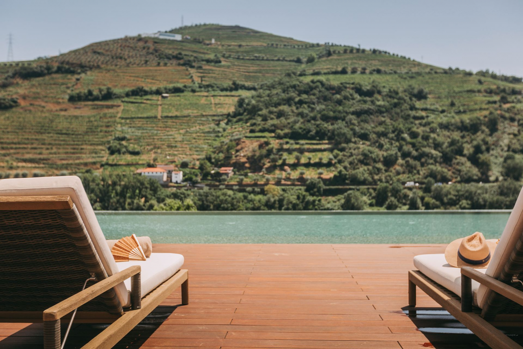 Portugal’s Bucket List Hotels — Quinta da Vacaria, a luxury wine estate in the Douro Valley surrounded by terraced vineyards and the winding river landscape, blending traditional winery heritage with refined contemporary hospitality.