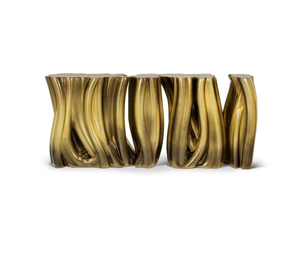 Sculptural gold side tables with fluted, twisting vertical forms resembling flowing drapery, luxury design.