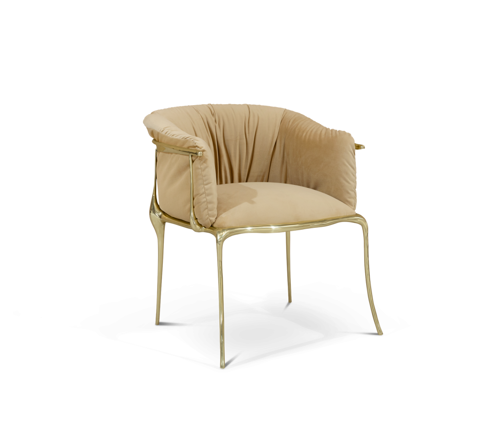 Beige velvet Nº11 armchair with polished brass frame and slender legs isolated on a transparent background, luxury armchair.