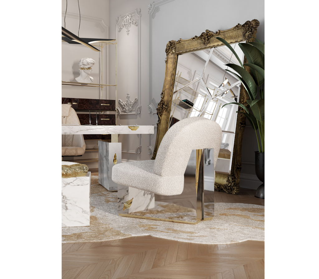 Cream bouclé accent chair with an arched high back and mirrored gold and marble panel legs, set beside a large ornate gold-framed mirror and marble console table-luxury armchair