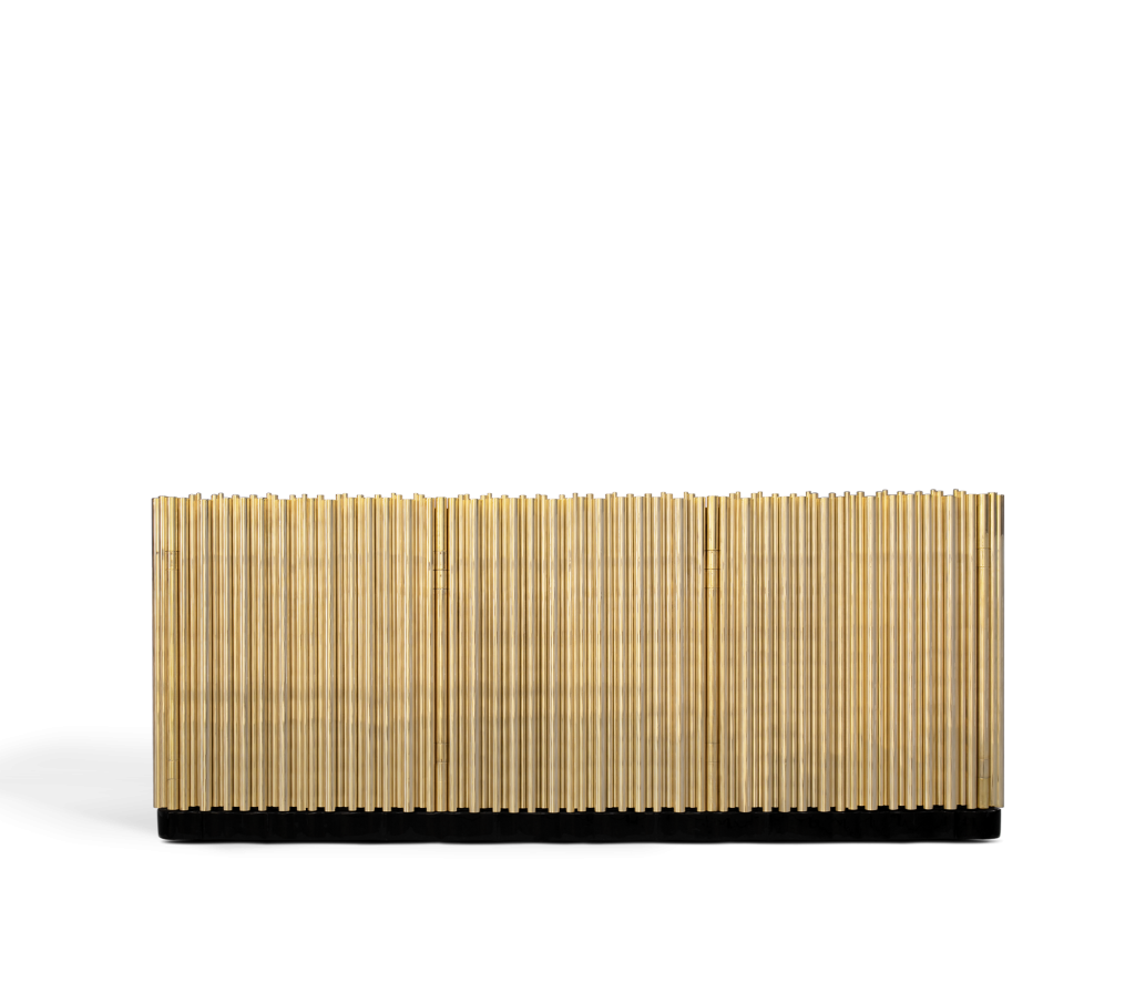 Long gold sideboard with a rippled facade of vertical polished rods on a black base, luxury design.