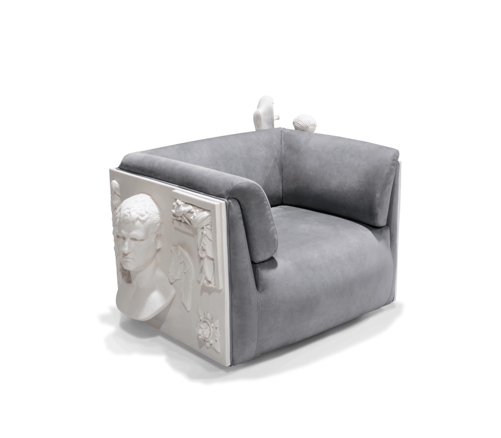 Grey Versailles armchair featuring a sculptural carved side panel inspired by classical sculpture isolated on a white background, luxury armchair.